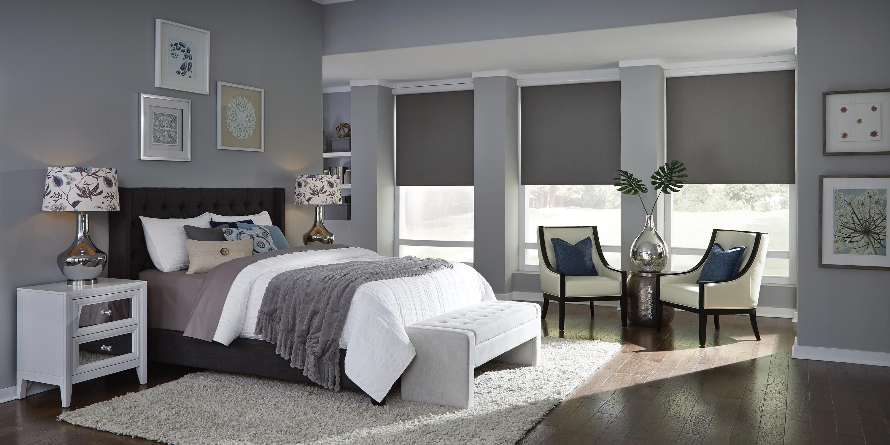 Lutron Sivoia QS shades in a grey and white bedroom